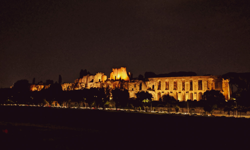 The Circus Maximus in Rome, lit up at night time